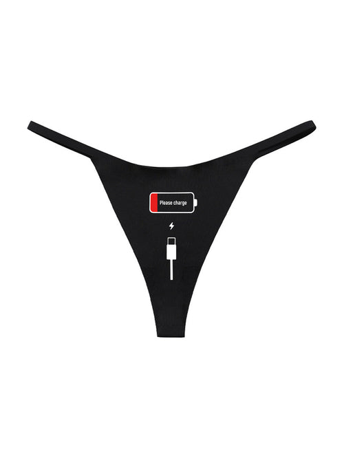 Flat lay presentation of the black seamless thong showcasing the cheeky 'Please charge' battery graphic.