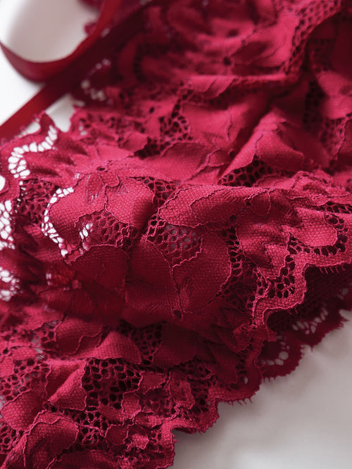 Detailed close-up highlighting the premium texture and delicate eyelash-style fringe of the crimson lace.