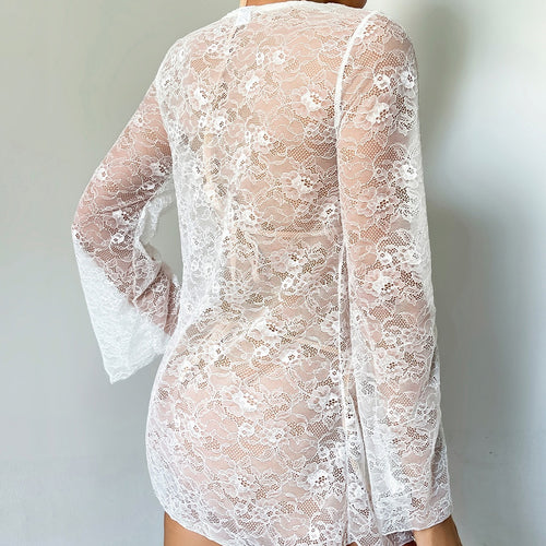 Back view of white sheer lace long-sleeve resort cover-up