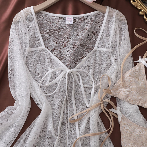 Detailed flat lay of white lace long-sleeve cardigan