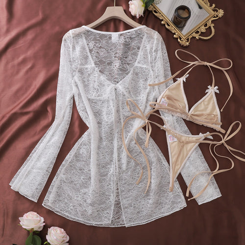 Flat lay view of lace cover-up and bikini top