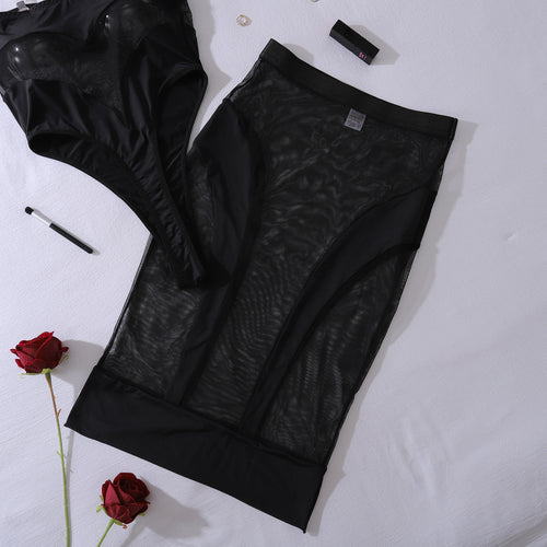 Flat lay shot of the Midnight Muse sheer mesh bodysuit set with gloves and accessories, highlighting the complete provocative ensemble.