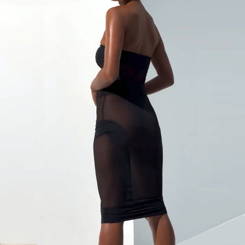 Close-up of the ultra-sheer mesh bodysuit showing the strategic structural black paneling designed for a visual sculpting effect.