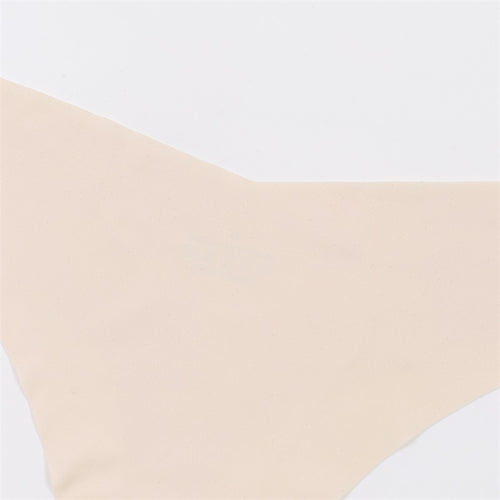 Close-up flat lay showing the clean seamless edges and smooth texture of the nude ice silk fabric.