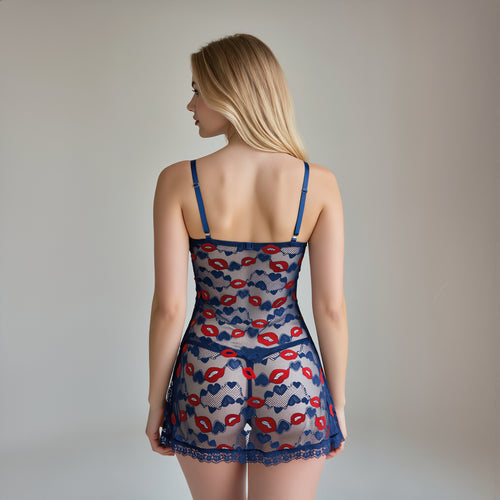 Back view of a model showcasing the sheer navy mesh and adjustable straps of the KissKismet lip print chemise.