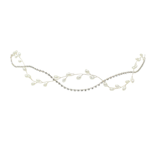 Flat lay product shot of the intertwined silver rhinestone chain and faux pearl bridal hair vine.