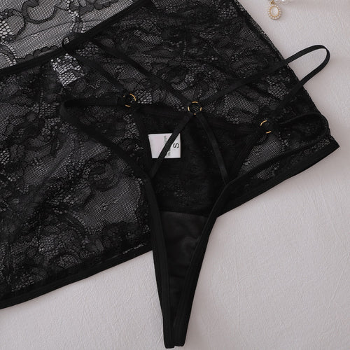 Close-up of sheer lace skirt hem and thong structure