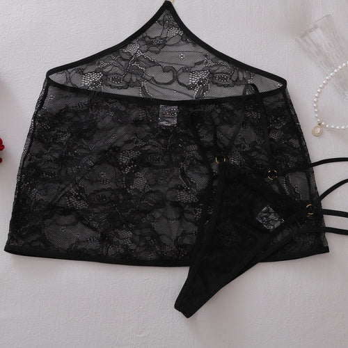 Flat lay of sheer lace mini skirt and matching thong