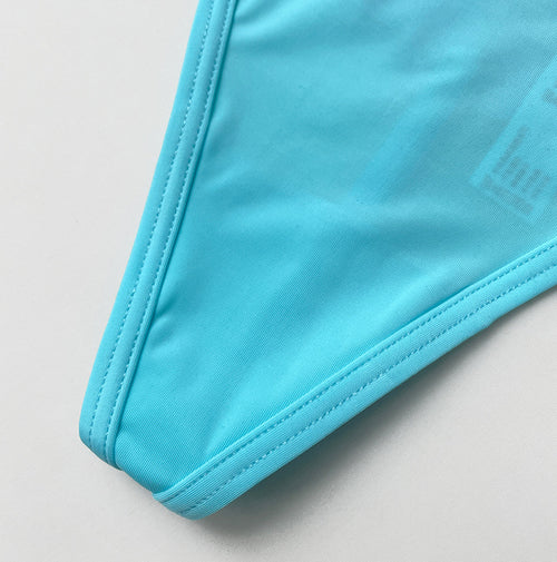 Close-up of the silky-smooth, seamless-finish microfiber fabric on the front panel.
