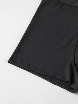 Close-up detail of the smooth, skin-friendly stretch fabric and comfortable seamless leg hem of the novelty black boxer briefs.