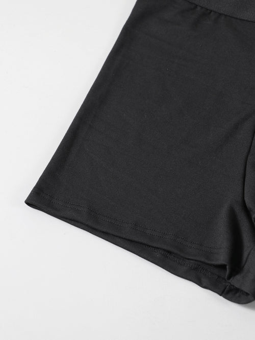 Close-up detail of the smooth, skin-friendly stretch fabric and comfortable seamless leg hem of the novelty black boxer briefs.
