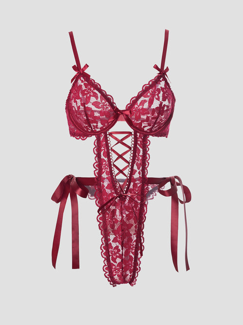 Flat lay view of the bodysuit's back construction, detailing the provocative strappy design and adjustable hardware.