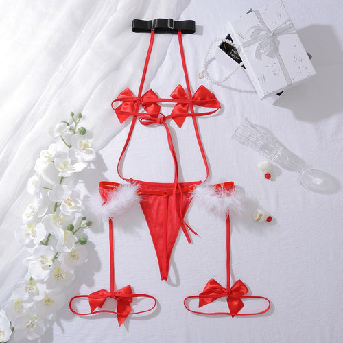 Flat lay showing the halter neck closure and strappy open-back details of the red lingerie set.