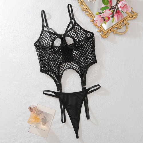 Flat lay presentation of the KissKismet black fishnet 2-piece set, clearly showing the separate top and thong.