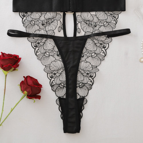 Close-up flat lay of the back side, highlighting the strappy thong back and sheer lace.
