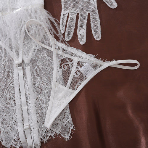 An illustrative alternate view flat lay focusing on the construction and heavy craftsmanship of the bra and thong.
