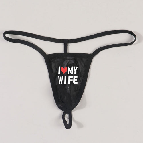 Extreme close-up flat lay detailing the stimulating pearl attachment and ultra-thin string construction.