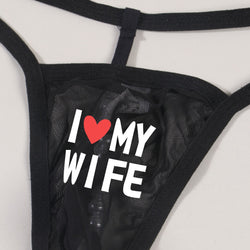 Back on-body view highlighting the minimalist single-string T-back design and erotic pearl detail of the men's thong.