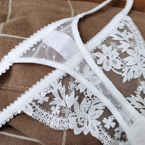 Inside flat lay view of the KissKismet white double-strap thong, featuring the breathable 100% cotton gusset.